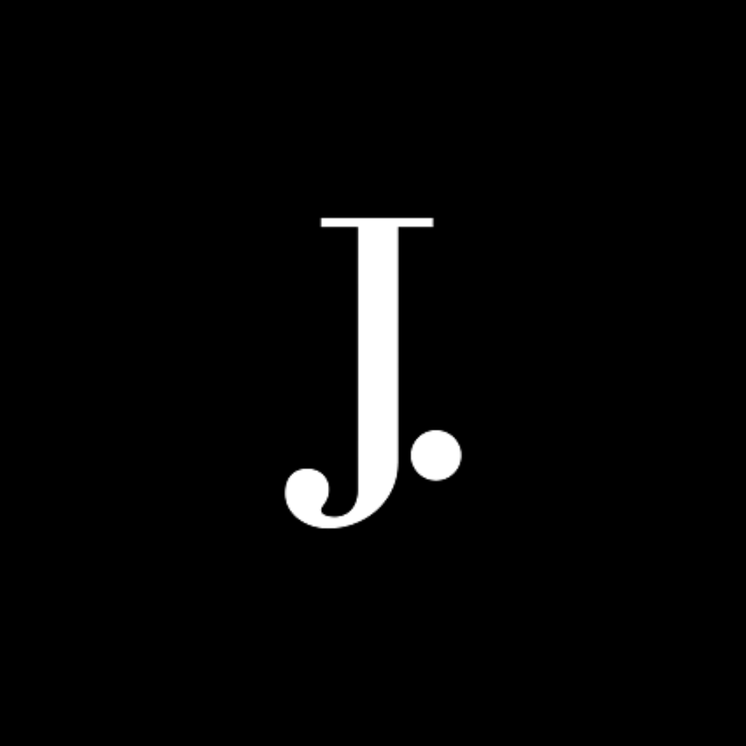 J.